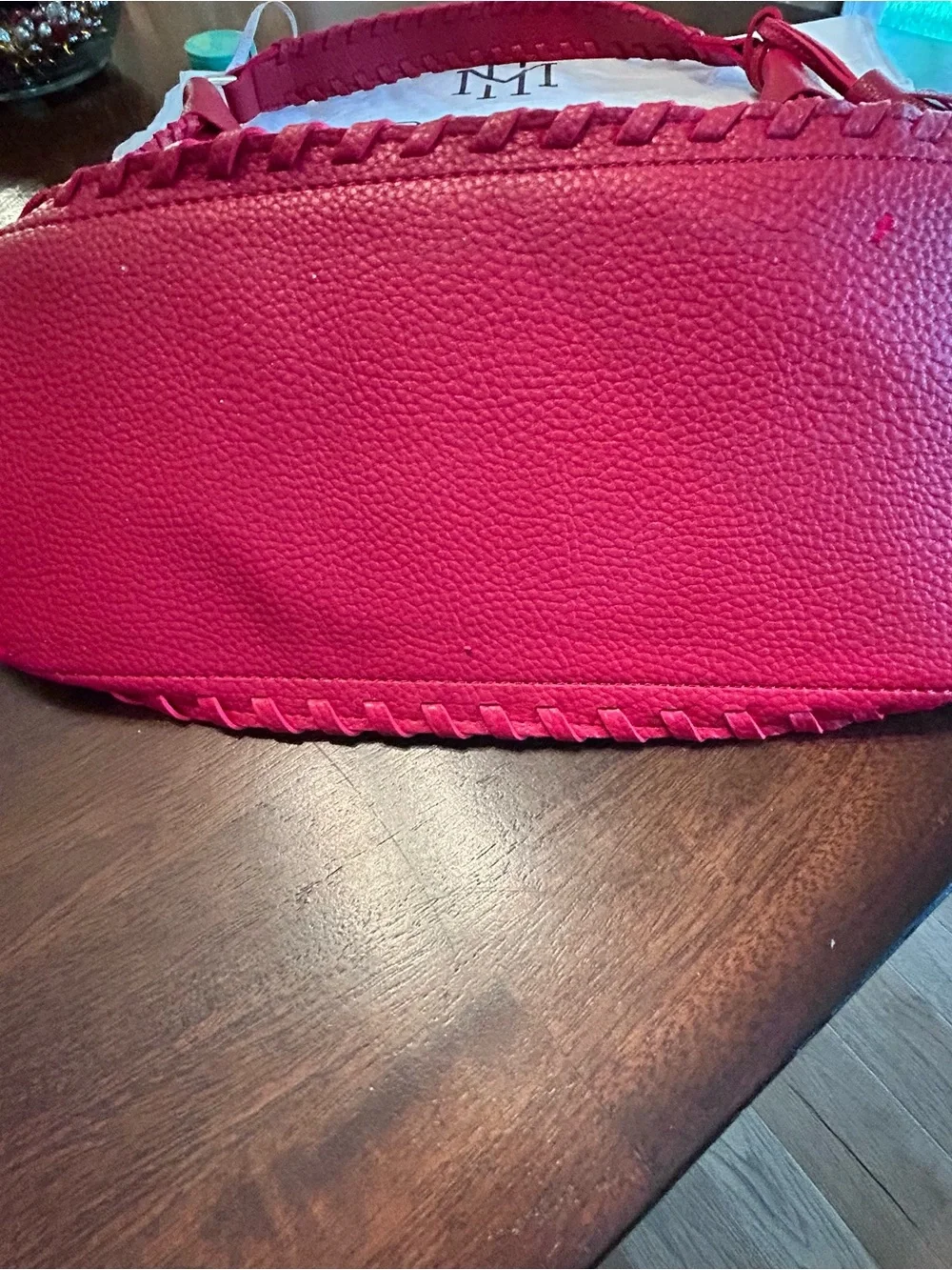 Mark & Hall shoulder Red pebbled Hobo Bag with Braided Trim and red tassel.